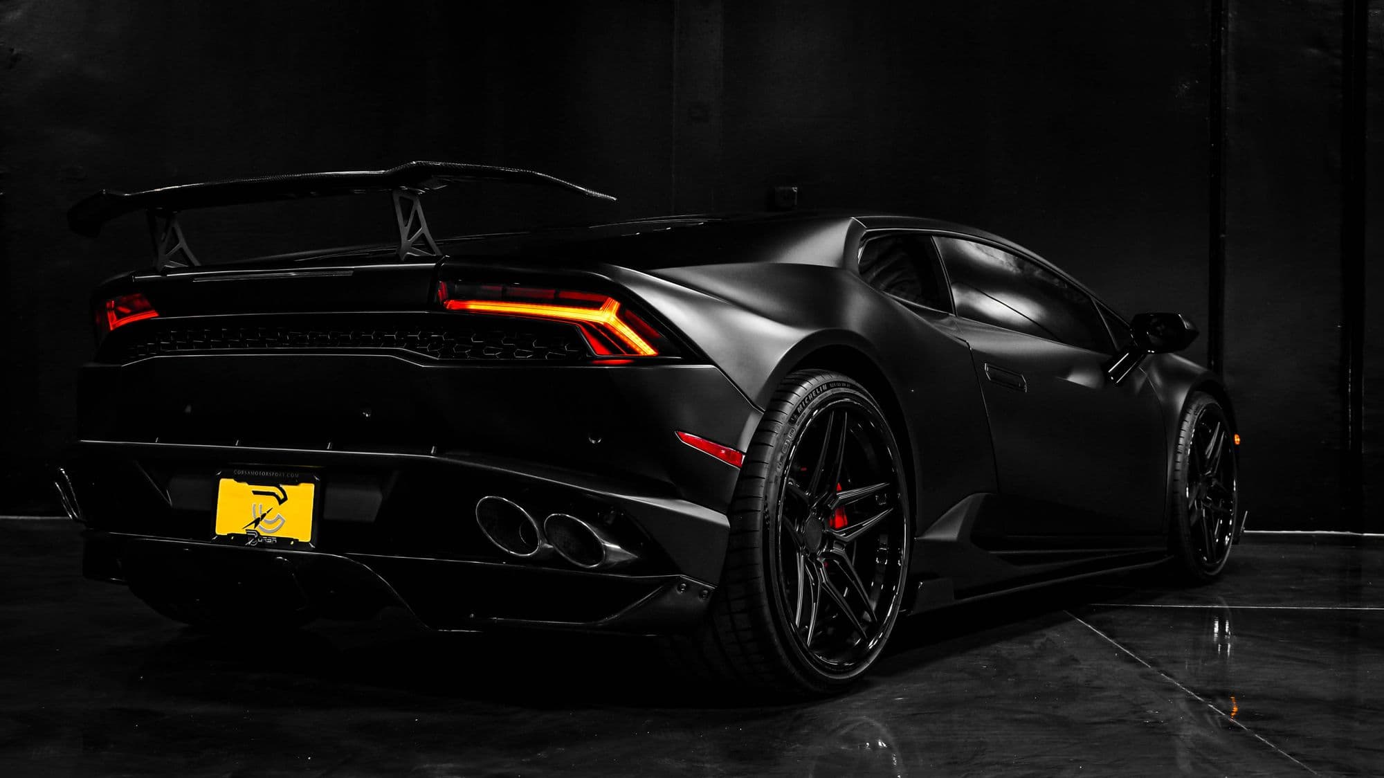 Satin-black Lamborghini in a dark showroom, shown as finish inspiration