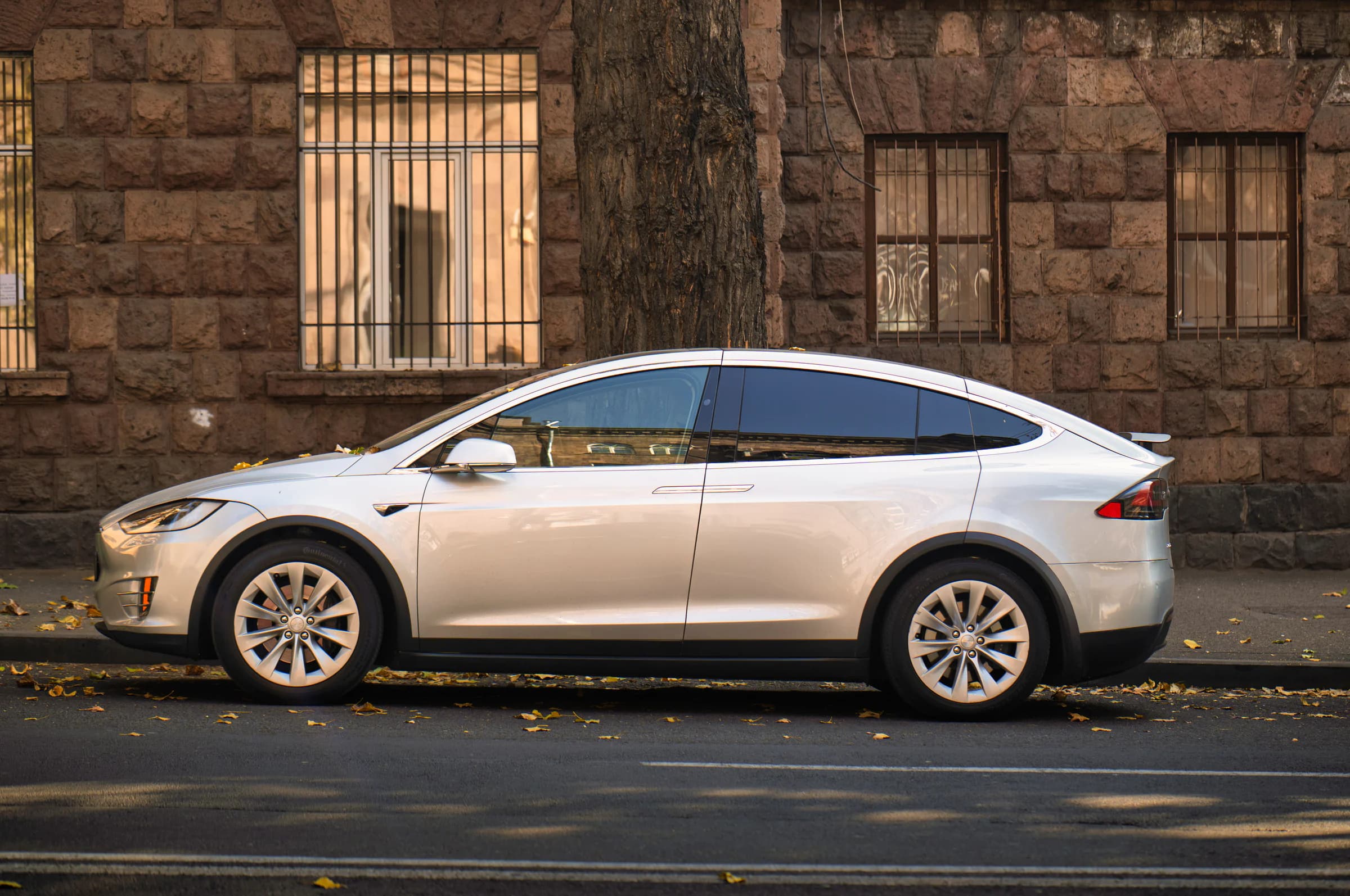 Silver electric vehicle with a clean reflective exterior